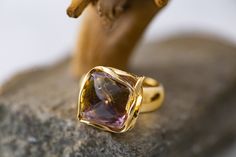 Cordis Art presents designer and elegant ring. Unique piece of Ametrine fitted in sterling silver and covered by 14ct gold layer. Handmade ring. Individual setting has been created for this particular stone. Transparent, bicolored quartz with the color of both amethyst and citrine in the same gem is called Ametrine. Elegant and designer ring. Perfect for evening dress and for every day.  Size of design: length 15mm, width 14mm. Size of the stone: length 12mm, width 12mm, high 12mm. This ring comes with lifetime craftwork warranty for your peace of mind. Gift wrap is also provided.  Cordis means heart. Cordis Art is the place where you can find jewellery made from the depth of my heart. I'm a mum of two girls with special needs. This situation made me to give up my professional carrier. I f Handmade Gold Diamond Ring Elegant Style, Elegant Yellow Gold Amethyst Open Ring, Luxury Formal Rings With Unique Design, Luxury Rings With Unique Design For Formal Occasions, Luxury Formal Ring With Unique Design, Unique Formal Rings With Polished Finish, Modern Gold Amethyst Ring, Elegant Topaz Ring With Tension Setting For Formal Occasions, Unique Yellow Gold Topaz Ring For Formal Occasions