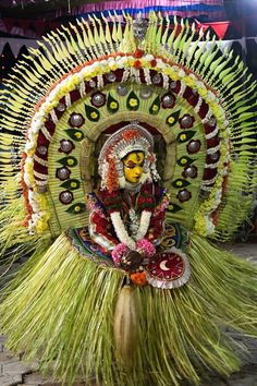 an elaborately decorated headpiece is displayed on display