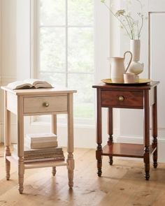 two wooden tables with books and vases on them