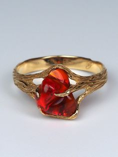 18K yellow gold ring with natural Mexican Fire Opal opal origin - Mexico stone weight - 1.67 carats stone measurements - 0.39 х 0.43 in / 10 х 11 mm ring size - 8 US  ring weight - 3.13 grams ref No 2456 LAYAWAY PAYMENT PLAN is available. Feel free to contact us with any questions or for additional pictures or videos. We ship our jewelry worldwide - for our customers it is free of charge and fully insured (with tracking). To ensure that everything arrives securely and unharmed at the recipient, Red Opal Gemstone Ring For Formal Occasions, Opal Gold Ring, Mexican Fire Opal Ring, Fire Jewelry, Mexican Opal, Fire Opals Jewelry, Red Opal, Carved Ring, Orange Stone