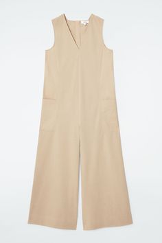 Lean into the ease of summer with effortless pieces like this V-neck jumpsuit. Offered in classic black, it's made from a breathable cotton blend and cut in an oversized shape with side panels in a contrasting fabric. It's finished with a deep patch pocket on either leg. Oversized fitZip closure Shell: 65% Cotton, 27% Polyamide, 8% Elastane. Side panels: 100% Cotton. Excluding trims / Machine wash Inside leg length of size 6 is 25.59" / Model wears a size 6 Side Panels, Panel Siding, Oversized Fits, Patch Pocket, Classic Black, All In One, Jumpsuit, Cotton Blend, Women Wear