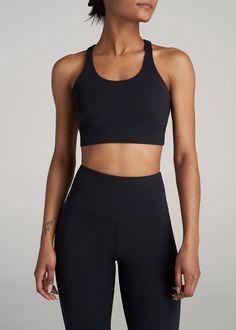 American-Tall-Women-Balance-Crisscross-SportBra-Black-front Black Activewear With Built-in Padding And High Stretch, Black Sports Bra With Built-in Bra And Medium Support, Black Compression Activewear With Built-in Padding, Sporty Black Sports Bra With Built-in Bra, Supportive Fitted Black Activewear, Supportive Stretch Black Sports Bra, Supportive Black Stretch Sports Bra, Supportive Black Activewear For Pilates, Black High Stretch Supportive Sports Bra