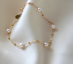 Bridal freshwater pearl gold-filled bracelet.    Matching pearl necklace    https://www.gosiameyerjewelry.com/shop/freshwater-pearl-choker-necklace/ Cheap Elegant Metal Pearl Bracelet, Gold Bracelet With Pearls, Adjustable Gold Pearl Necklace For Anniversary, Yellow Gold Bracelet With Gold Beads For Wedding, Gold Pearl Jewelry With Extender, Dainty Gold Bracelet With Pearl Chain, Gold Akoya Pearl Bracelet For Wedding, Gold Pearl Chain Bracelet In 14k Gold Filled, Adjustable Akoya Pearl Wedding Jewelry