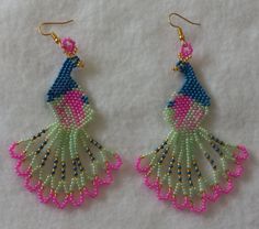 These hand beaded peacock earrings measure approximately 3 1/2" long x 1" wide. Beaded Peacock, Peacock Earrings, Taos, Etsy Earrings Dangle, Hand Beading, Jewelry Earrings Dangle, Etsy App, Selling On Etsy, Sell On Etsy