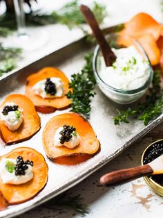 small appetizers are arranged on a tray