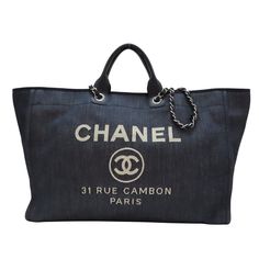 CHANEL Deauville Tote Bag Denim Blue Silver Metal Description / Specification Brand Name CHANEL Item Name CHANEL Deauville Tote Bag Denim Blue Silver Metal Color Material denim Size H:37cm x W:50cm x D:17cm (H:14.6" x W:19.7" x D:6.7") Handle：32cm(12.6") Shoulder：72cm(28.3") Pocket >Magnetic pocket >Inside /Open x 3/inside zip pocket x 1 Accessories Guarantee Comes With The individual serial number (Horogram Sticker number) is not shown to protect personal information. It is actually engraved on the product. Date Code 244332871 Instore Code 2164700009379 Up Date 2024/11/20 Condition Pre-owned used Tote Bag by CHANEL in good condition. Outside Condition There is some usability, scratches, rubbing, and stain. Please take a look at the descriptions and the pictures above to check the conditio Gucci Luggage, Chanel 2017, Fabric Tote, Chanel Deauville Tote Bag, Handbags Online, Chanel Bags, Wrapping Ideas, Chain Shoulder Bag, Shopping Tote