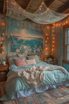 a bed in a room with lights hanging from the ceiling and a painting on the wall