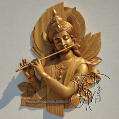 a golden statue is holding a flute and playing the instrument in front of a white wall