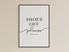 a black and white poster with the words shoes off please written in cursive font