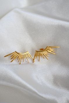 "Introducing Sol stud - the perfect accessory for any occasion. Made with Sun Style stainless steel and plated with 18k gold, these studs are durable and stylish. Elevate your look with this high-quality, affordable piece."