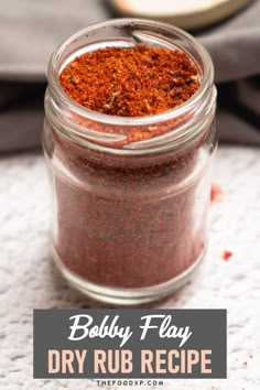 a jar filled with dry rub on top of a table