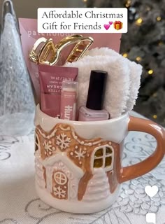 a coffee cup filled with christmas items on top of a table