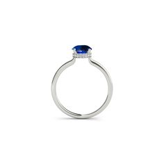 The hidden halo of our Casey round sapphire engagement ring elevates a minimal style into a truly special piece. With its secret diamond halo sitting just below the center stone, the stunning Casey engagement ring is a classic solitaire with a personal touch. From the top view, a round sapphire is held in a simple, beautiful setting. Four curving claws sweep into the diamond-studded bezel below, this delicate detail adding a luxurious accent for your eyes only… A fine, polished band ensures the Lab-created Sapphire Diamond Ring With Halo Design, Round Cut Halo Design Birthstone Promise Ring, Halo Design Birthstone Ring For Promise, Round Cut, Halo Design Round Cut Birthstone Promise Ring, Classic Halo Round Cut Birthstone Ring, Classic Round Cut Halo Birthstone Ring, Modern Halo Setting Round Cut Ring, Modern Round Cut Halo Setting Ring, Modern Round Diamond Ring With Halo Setting