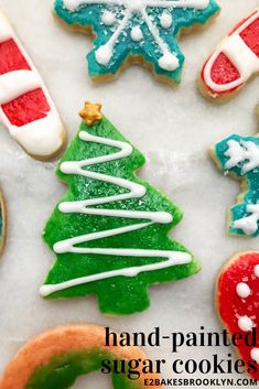 decorated christmas cookies with white icing and red, green, and blue frosting