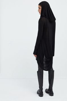 Meet our Oslo Tunic, the definition of elevated loungewear. Fashioned from soft and high-stretch sheer European jersey, she offers comfort that you can live in for days on end. Oslo updates the tunic silhouette with stunning details, such as an oversized hood and a draped, high-low hem that dips at the back. Her dropped shoulders extend to relaxed long sleeves, complete with thumbholes for a cozy, finishing touch. Shop also her best-selling sister hoodie, Firenze, crafted from our European Frenc Elevated Loungewear, Hooded Tunic, Wool Coats, Black Tunic, Petite Size, High Low Hem, Womens Clothing Tops, High Low, Winter Outfits