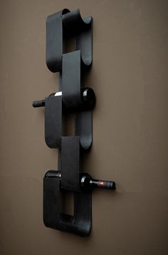 a wine rack mounted to the side of a wall