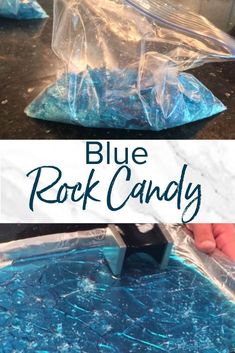 the blue rock candy is being made with plastic wrappers and then placed on top of it