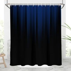 a black and blue shower curtain with white trim