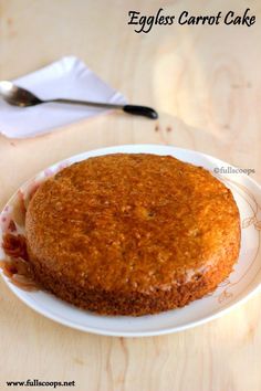 an eggless carrot cake on a white plate