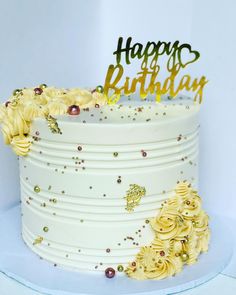 a white cake with yellow flowers on it