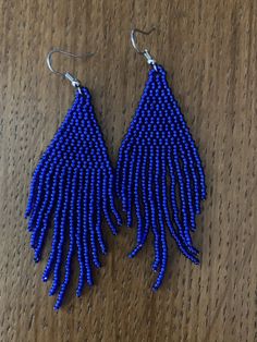 Cheap Blue Beaded Earrings For The Beach, Cheap Southwestern Blue Beaded Earrings, Blue Fringe Dangle Chandelier Earrings, Blue Fringe Beaded Drop Earrings, Blue Fringed Beaded Drop Earrings, Blue Fringe Drop Earrings, Elegant Blue Fringe Jewelry, Blue Beaded Fringe Drop Earrings, Blue Tassel Drop Earrings With Dangling Beads