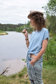 "Excellent denim blouse for your midsummer nights. It is not a mistake - buttons are on the back! Size: label says S, seems like women's (S) MEASUREMENTS: Length: 57 cm/ 22\" (without ties) Shoulder to shoulder: 50 cm/ 20\" Chest: 116 cm/ 46\" Condition: excellent Fabric: Lyocell Brand: unknown * Wash at temperature not higher than 30oC / 86oF Model wears: UK 8/ EU 36/ US 4 Model's height: 175 cm/5'7\" You can find more similar shirts here: https://www.etsy.com/shop/OnTheRoadStore?section_id=239 Casual Summer Denim Top, Indigo Short Sleeve Cotton Denim Top, Indigo Short Sleeve Denim Top, Casual Washed Blue Summer Blouse, Indigo Cotton Denim Top With Short Sleeves, Summer Washed Blue Relaxed Fit Blouse, Washed Blue Relaxed Fit Blouse For Summer, Washed Blue Relaxed Fit Summer Blouse, Summer Medium Wash Denim Shirt