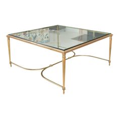 A well-proportioned, square Louis XVI style brass coffee table with a heavy inset glass top, gently tapered and fluted legs and a gracefully swept cross-form stretcher.   Product Information: Materials: Brass, Glass Dimensions: 36” W x 36” D x 16.5” H  Style: Louis XVI  Condition: Very good vintage condition. Minor surface wear consistent with age and use. Structurally sound.  Shipping: $650  About Us: We curate antique, vintage and high-end, gently-used home furnishings sourced from some of the Brass Coffee, Glass Tables, Square Coffee Table, Brass Coffee Table, Louis Xvi Style, Coffee Table Square, Living Room Inspo, H Style, Louis Xvi