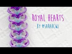 a purple and blue ribbon with the words royal hearts on it