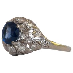 Ring Size: 5.5 Metal Type: Platinum [Hallmarked, and Tested] Weight: 2.5 grams Center Stone Details: Type: Sapphire, Natural Weight: 1.00 carat Cut: Transitional Round Color: Blue Clarity: SI2 Side Diamond Details: Weight: .15 carat, total weight Cut: Antique Single Cut Color: G Clarity: SI Finger to Top of Stone Measurement: 5mm Condition: Excellent Classic Pear-shaped Sapphire Ring, Estate Oval Diamond Ring With Hallmark, Estate Oval Hallmarked Diamond Ring, Estate Style Oval Hallmarked Diamond Ring, Estate Oval Diamond Ring For Formal Occasions, Estate Style Oval Diamond Ring For Formal Occasions, Formal Oval Estate Diamond Ring, Classic White Gold Sapphire Ring, Pear-shaped, Estate Oval Diamond Rings