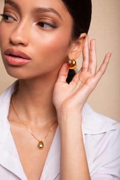 Ignite your style with the enchanting Jora Necklace. Plated in 18k gold, this captivating accessory adds a touch of luxury to any ensemble. Its tear-shaped pendant, measuring 28mm (h) by 16mm (w), exudes elegance. Crafted from nickel-free and lead-free brass, it ensures comfort and compatibility with sensitive skin. With a length of 18 inches plus a 2-inch extender, the Jora Necklace offers a perfect fit for every occasion. Elevate your look and leave a lasting impression with this timeless piece of beauty. Product Detail 18k gold plating Brass Size:18in+2in Pendant size: 28mm(h) 16mm(w) Nickel-Free Lead-Free Jewelry photos are enlarged to show detail. Packaging Every Ose purchase will arrive in a box . In that box our pieces are placed in our microfiber pouches or white jewelry boxes. All Chic Tarnish-resistant Teardrop Jewelry, Timeless Teardrop Jewelry For Everyday Elegance, Timeless Teardrop Everyday Elegance Jewelry, Timeless Teardrop Jewelry For Casual Elegance, Luxury Pear Drop Necklace, Formal Teardrop Jewelry With Polished Finish, Formal Rose Gold Teardrop Jewelry, Elegant Oval Pendant Drop Necklace For Gift, Polished Drop Jewelry For Wedding