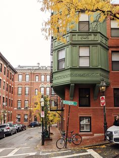 an apartment building on the corner of a street