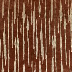 an area rug with brown and white designs on it's sides, in the shape of wavy lines