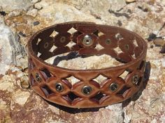 This choker is made from a upcycled leather belt.  This leather choker has a unique diamond punched design. This punched design is repeated along the length of the choker with silver studs added for visual intrest.  So fun!  The leather is brown but has the look of having been sanded to give it a rustic, used look. The choker closes at the back with a silver snap.  It will fit a 13.5 inch (34.25 cm) neck comfortably.  This would be a great gift.  This choker would look great on anybody! Choker m Unique Brown Choker For Festival, Unique Brown Festival Choker, Unique Adjustable Brown Choker, Choker Diamond, Yarn Necklace, Tshirt Yarn, Leather Necklaces, Leather Wallet Pattern, Necklace White Gold