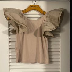 Darling Ruffle Sleeve Crop Tee! Looks Cute With Literally Anything!! Casual Beige Top With Ruffles, Beige Cotton Ruffle Tops, Beige Cotton Tops With Ruffles, Trendy Beige Tops With Ruffles, Trendy Beige Ruffled Tops, Crop Tee, Bucket List, Womens Tops, Crop Tops