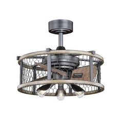 an industrial style ceiling fan with cage around it