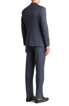 A refined two-button suit cut in a trim silhouette is the perfect go-to for any well-dressed event. 36.4" inseam; 7.8" leg opening; 10.6" rise (size 36) Jacket has notched lapels; chest welt pocket; dual flap welt pockets
 Lined 73% polyester, 25% rayon, 2% spandex
 Dry clean
 Imported Model stats: 6'1" height, 32" waist. Model is wearing size 36. Blue Workwear Sets With Button Closure, Blue Sets With Button Closure For Work, Tailored Single-button Pantsuit For Business Casual, Suits With Double Button Closure, Workwear Suits With Double Button Closure, Elegant Blue Double Breasted Suit With Button Closure, Formal Pantsuit With Notch Lapel And Welt Pockets, Elegant Blue Double-breasted Suit, Tailored Single Button Pantsuit With Notch Lapel