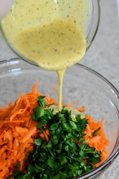 carrots and parsley being poured into a bowl