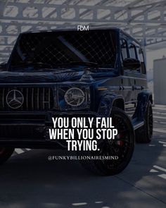 a black mercedes suv with the quote you only fail when you stop trying