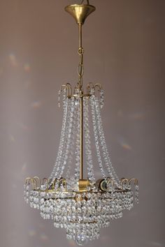 a gold chandelier hanging from a ceiling