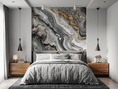 a bedroom with marble wallpaper and grey bedding