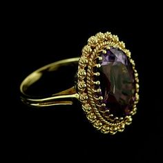 Amethyst Ring Victorian Style Cocktail Large Oval Amethyst Yellow Gold Bezel Set Gemstone Color Stone Classic twisted wire work around an oval amethyst (approx. 7.40cttw 16 x 12 mm), set with a gallery of prongs. This beautiful ring is made of 14k yellow gold and is available in all sizes, please contact us for your size preference. Ring Dimension: Top Height: 23 mm Width: 18 mm Center stone is set above the finger approx. 9mm PROUDLY MADE FROM SCRATCH IN NEW YORK CITY. SKU: R2166MA Our Pledge: Hallmarked Oval Yellow Gold Crystal Ring, Hallmarked Yellow Gold Oval Crystal Ring, Victorian Oval Amethyst Ring With 17 Jewels, Oval Yellow Gold Amethyst Ring With Polished Finish, Oval Amethyst Ring In Yellow Gold With Polished Finish, Elegant Oval Purple Rings, Antique Oval Amethyst Ring With Center Stone, Victorian Oval Amethyst Ring For Anniversary, Wedding Amethyst Ring In Polished Yellow Gold