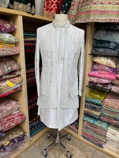 Introducing our Ivory Open Jacket Sherwani with Thread Work and Button Down Kurta Inside, enhanced with Mirror Work and Red Hints All Over the Sherwani, a luxurious and stylish traditional garment perfect for weddings or any special occasion. Made from high-quality materials, this sherwani features intricate thread wor Open Jacket Sherwani, Mens Sherwani, Indian Bridal Lehenga, Open Jacket, Modern Traditional, Mirror Work, Thread Work, Bridal Lehenga, Indian Bridal