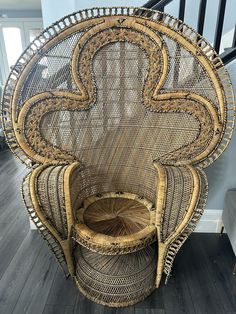 a wicker chair sitting on top of a hard wood floor