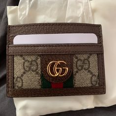 Never Used Gucci Card Holder Comes With Box And Dust Bag Gucci Brown Wallets With Interior Card Slots, Brown Gucci Wallets With Interior Card Slots, Designer Brown Card Holder For Gift, Designer Brown Card Holder As Gift, Chic Brown Card Holder For Everyday Use, Gucci Brown Wallet With Card Slots, Designer Brown Card Holder, Designer Brown Wallet, Chic Brown Card Holder