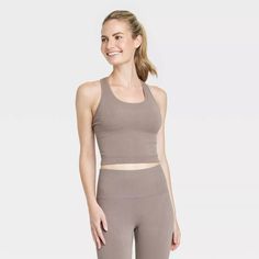 Women's Seamless Racerback Rib Tank Top - All In Motion™ : Target Seamless Racerback Tank Top For Sports, High Stretch Seamless Fabric Tank Top With Breathable Feature, Racerback Tank Top For Sports, Athleisure Seamless Scoop Neck Tank Top, Versatile Solid Scoop Neck Activewear, Versatile Solid Color Scoop Neck Activewear, Athleisure Moisture-wicking Seamless Tank Top, Athleisure Stretch Tank Top In Seamless Fabric, Stretch Seamless Tank Top For Workout