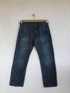 Vintage Levis 569 Jeans Dark Blue Levis 569 Denim Pants - BS40416.  Manual Measurement (laying in flat area):  1) Waist: 34 inch.  2) Rise: 10.5 inch.  3) Hips: 24 inch.  4) Tight: 12 inch.  5) Outseam: 42.5 inch.  6) Inseam: 31 inch.  7) Leg opening: 9 inch.  Fabric Material: 100% Denim Cotton.  Condition: In good vintage condition overall.  Please check all the measurement to ensure a proper fit.  Remember to allow yourself some extra room for movement.  You can compare these information with Casual Faded Straight Bottoms, Casual Straight Faded Bottoms, Casual Faded Straight Jeans, Casual Straight Faded Jeans, Faded Straight Casual Bottoms, Casual Straight Dark Wash Jeans, Casual Faded Flare Jeans, Classic Baggy Dark Wash Jeans, Straight Denim Blue Washed Bottoms