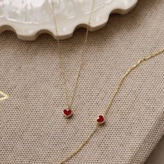 "Celebrate her birthday with this mesmerizing handrafted pendant design that features a shimmering red heart shape which suspends along an 18 inch 14k solid gold chain that secures it. RED*HEART*NECKLACE ‣ 2 Years Warranty ‣ Free Express International Shipping ‣ Free returns within 30 days from the order date Features * Made to Order. * Material: Solid Gold (real solid gold, no gold-filled or no gold plated material) * Gold KT: 14K * Gemstone: Enamel Stone * Length: 14\", 16\", 18\", 20\", 22\", Red Heart Bracelet, Small Red Heart, 14k Gold Initial Necklace, Red Heart Necklace, Gold Jewelry Gift, Nature Friendly, Gold Heart Necklace, Fancy Jewellery, Jewelry Lookbook