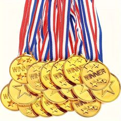 a bunch of medals sitting next to each other