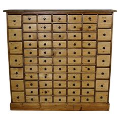 an old wooden dresser with many drawers