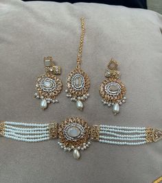 Beautiful and elegant Indian jewellery full set White Jewelry For Diwali Party, Elegant Choker Set For Diwali, Festive White Choker Jewelry, White Bollywood Style Party Jewelry, White Hand Set Jewelry For Eid, Round Jewelry For Eid Party, White Tikka For Eid Party, Party Jewelry With Stone Work For Eid, Elegant White Jewelry For Eid